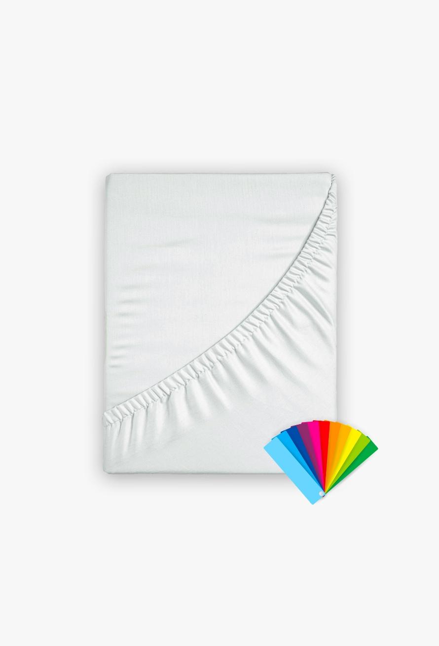Ein sauber gefaltetes Tamara-R Fixleintuch Selection-FIX Spannbetttuch in Weiß zeigt seinen elastischen Rand, während unten rechts ein Farbfächer in Blau, Rosa, Rot, Gelb, Grün und Orange erscheint.